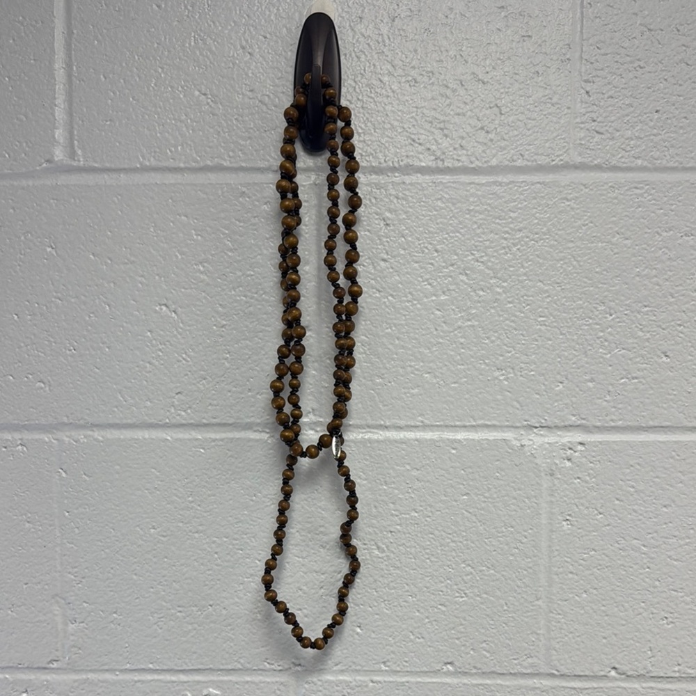 Brown Wooden Beaded Necklace with Leather Threading with knots.